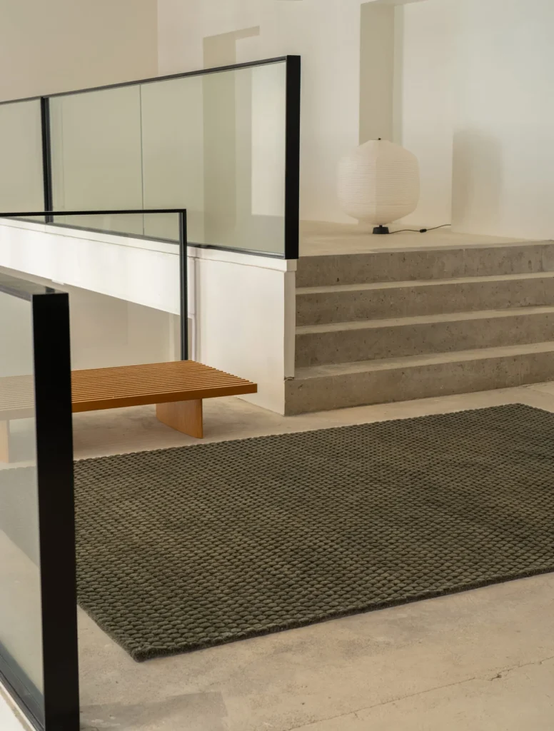 Dark green rug formed with dots